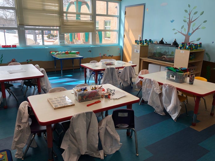 The STEM Lab offers students the opportunity to think scientifically and wear little lab coats. (Photo credit: RJ Scofield)